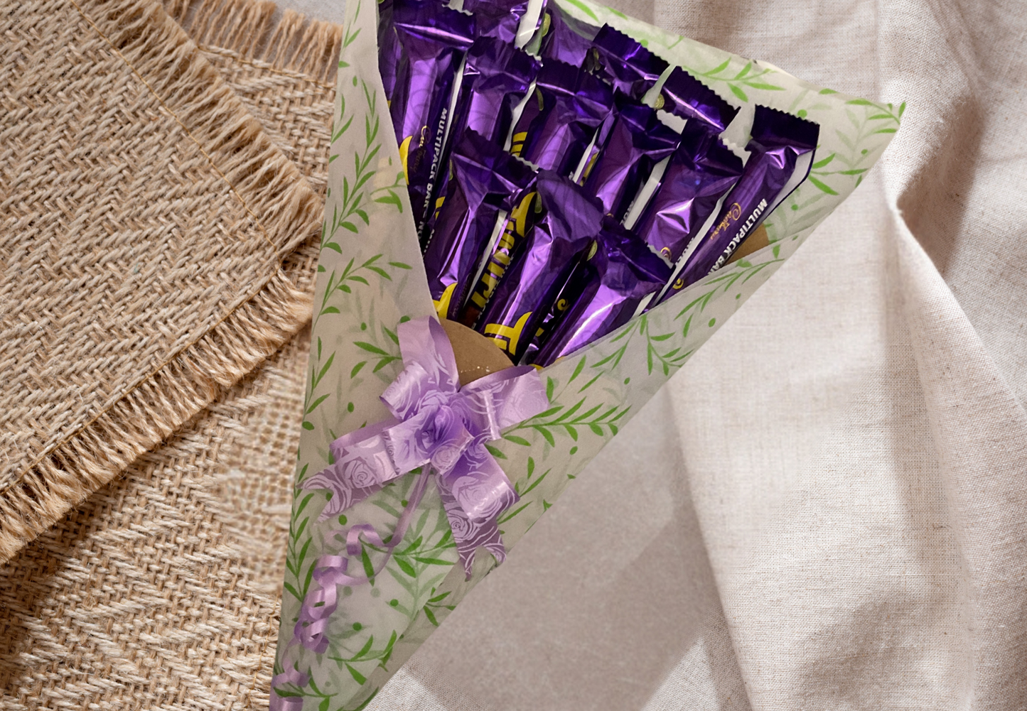 Cadbury twirl chocolate bouquet with a personalised tag and matching bow.