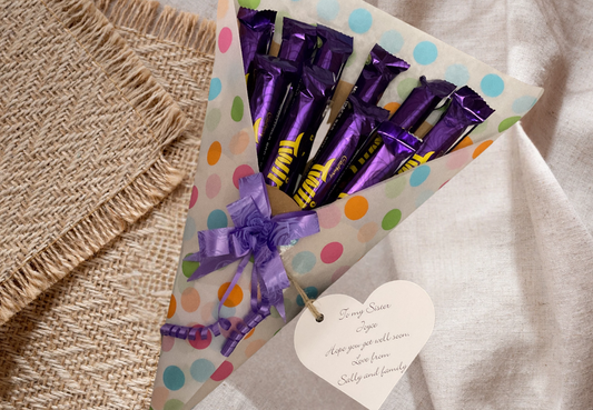 Cadbury twirl chocolate bouquet with a personalised tag and matching bow.
