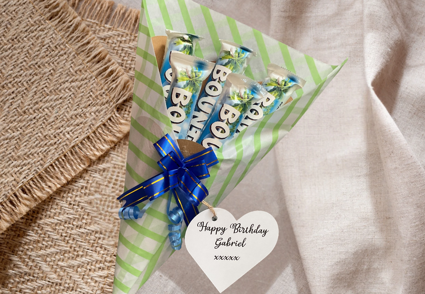Bounty chocolate bouquet with a personalised gift tag and matching bow.