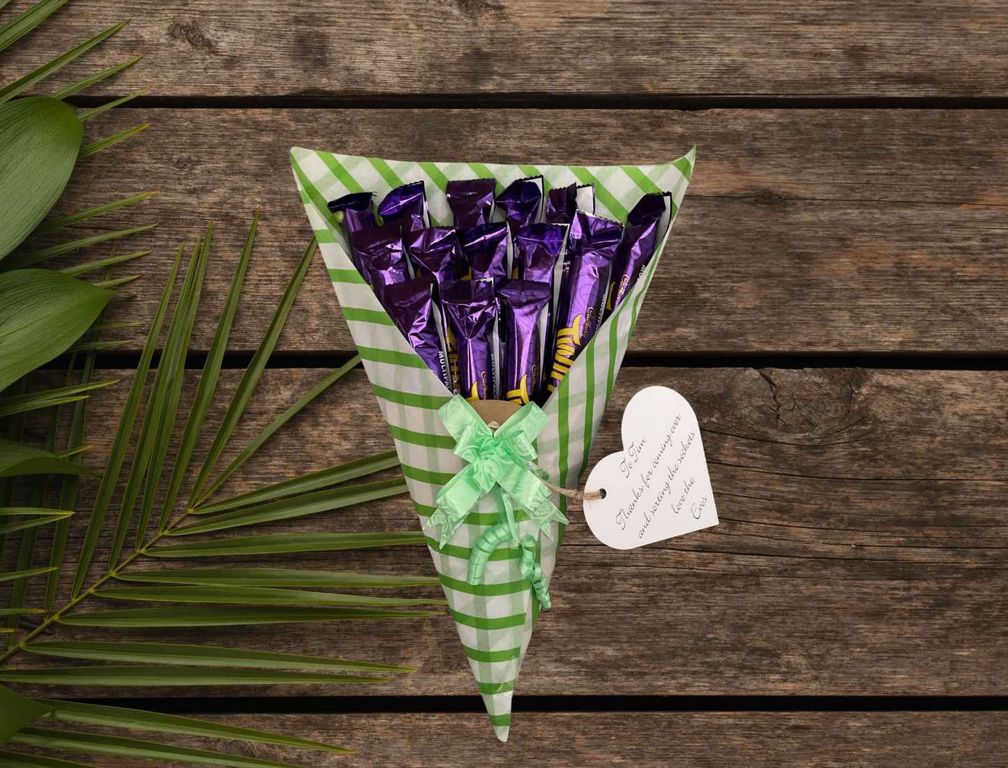 Cadbury twirl chocolate bouquet with a personalised tag and matching bow.