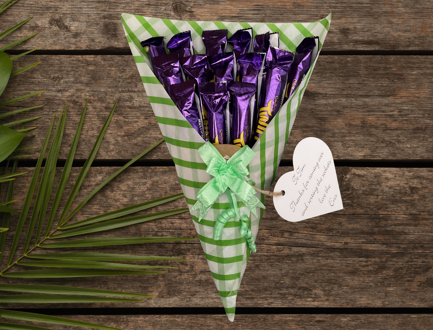 Cadbury twirl chocolate bouquet with a personalised tag and matching bow.